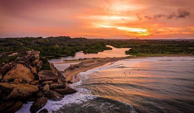 The Arugam Bay coastline and ocean at sunset