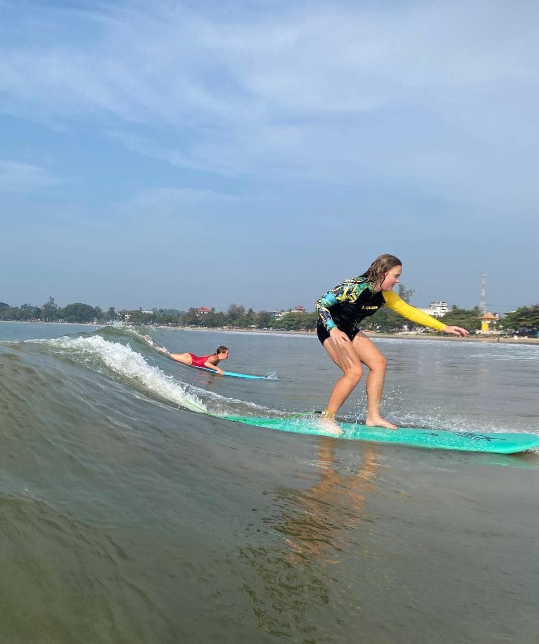 Surfer riding a wave in Sri Lanka